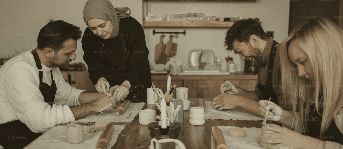 Team of artisans working together in a ceramic workshop